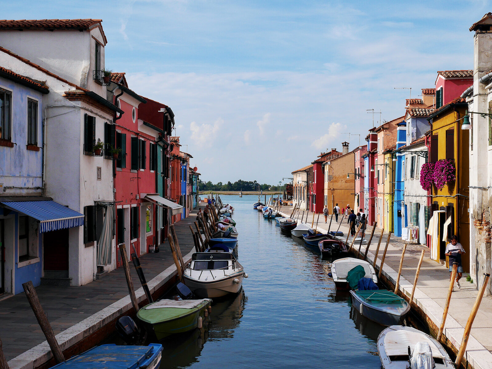 Burano : A quaint canal lined with colorful houses and small boats
