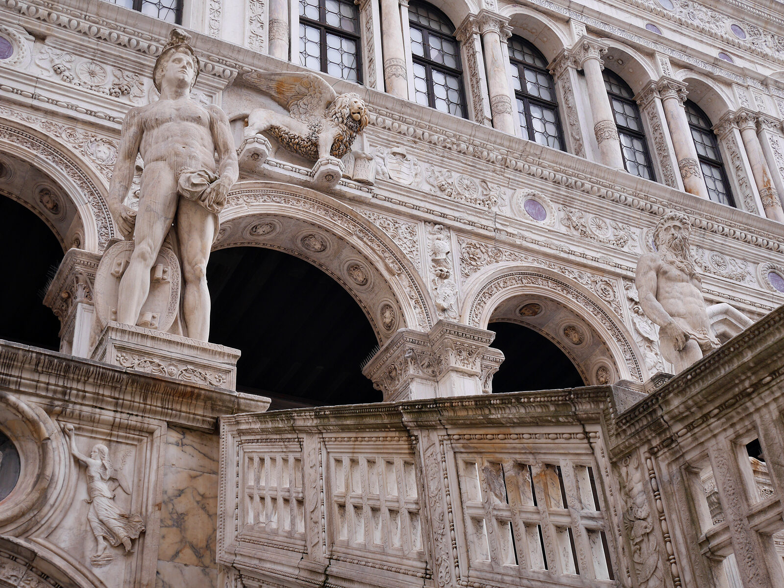 Doge's Palace : At the summit of the Giants' Staircase, which served as the gateway to the Doge's throne, stand two imposing marble statues of Mars and Neptune