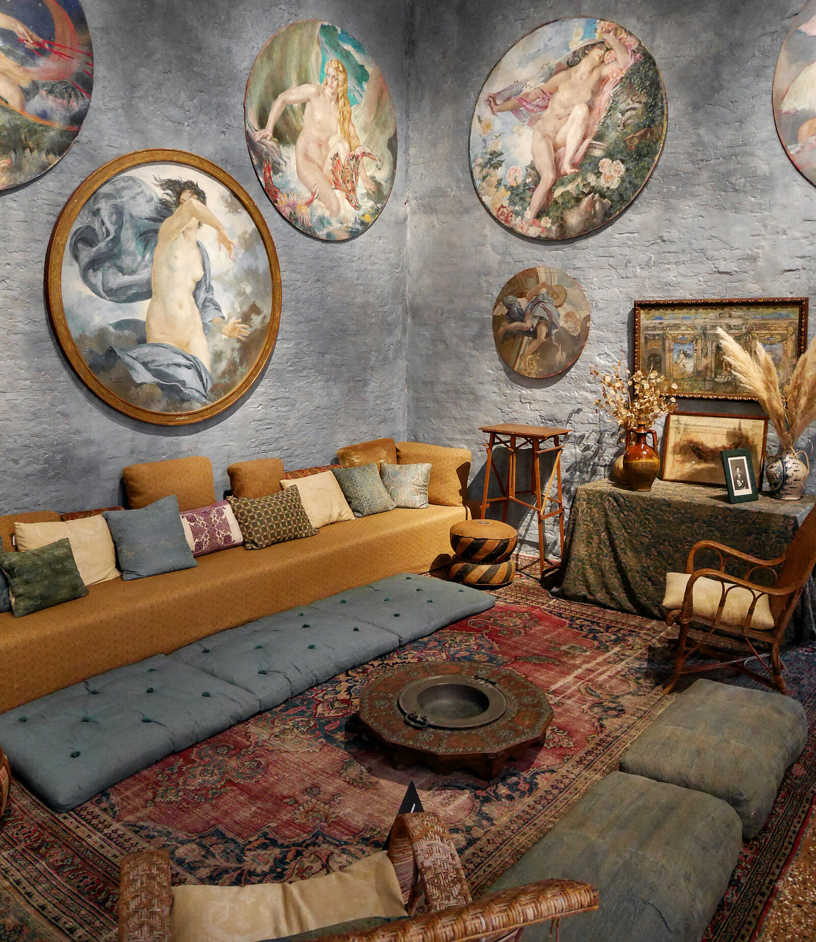 Fortuny Museum : The walls surrounding the cozy seating feature paintings from the cycle dedicated to the four elements: air, earth, fire, and water