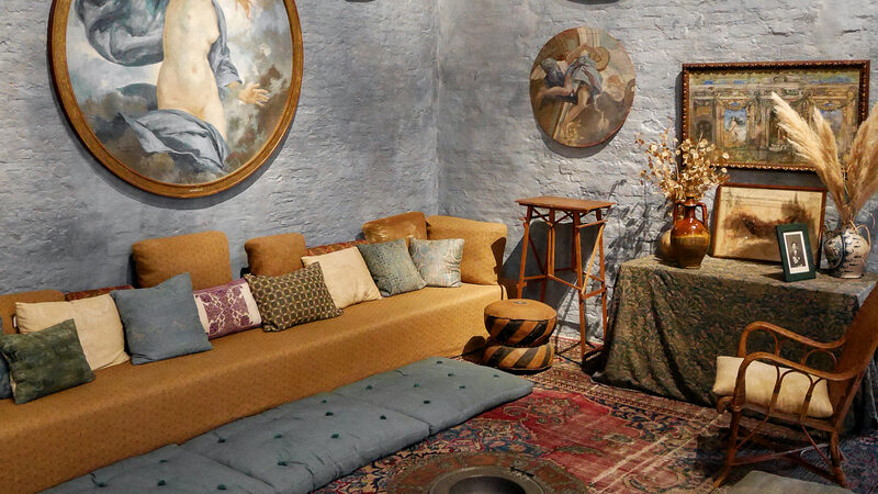 Fortuny Museum : The walls surrounding the cozy seating feature paintings from the cycle dedicated to the four elements: air, earth, fire, and water
