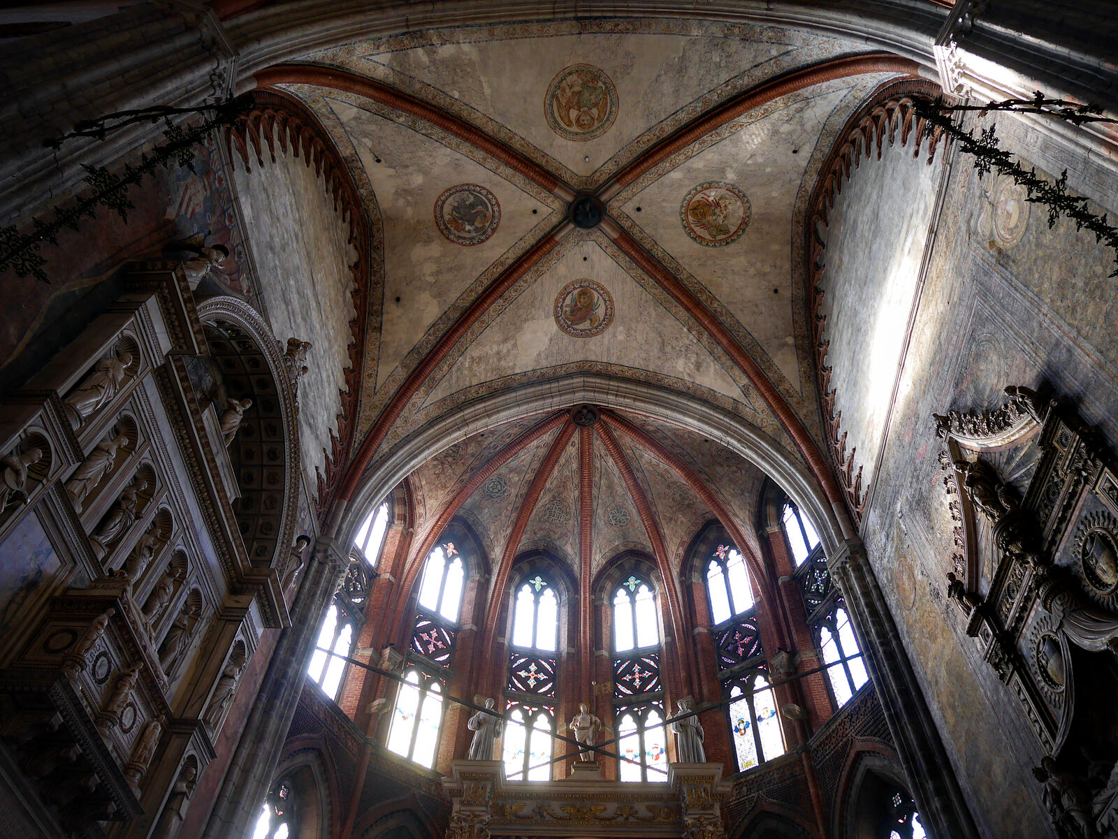 Frari Basilica : Looking upward from the high altar, you’ll see two monuments on either side of the presbytery, dedicated to Doges Tron and Foscari