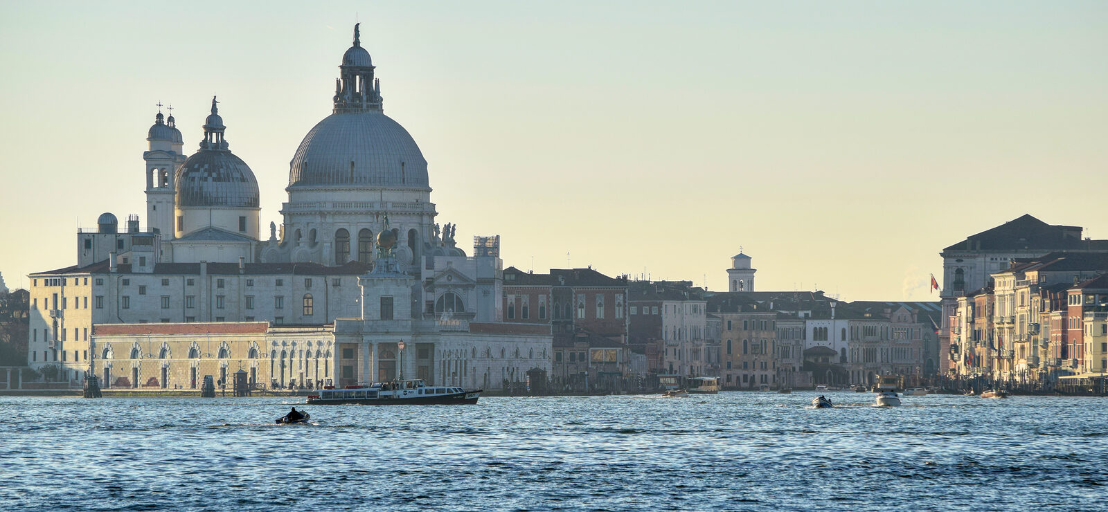 Grand Canal : Let's begin our sunset cruise from the end of the canal connecting to the lagoon and sail upstream, passing by Punta della Dogana