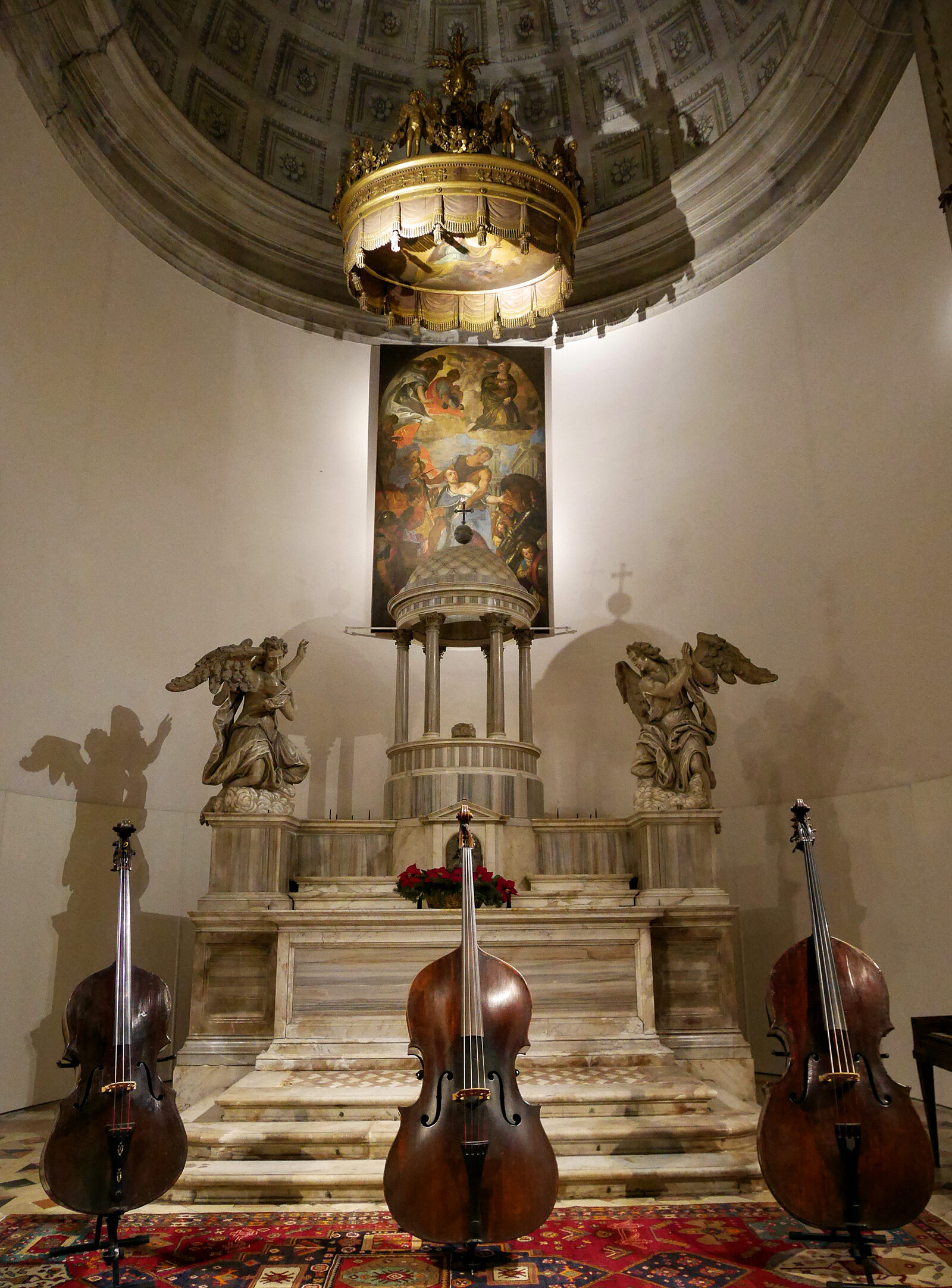 Music Museum : Three cellos stand majestically in front of the altar