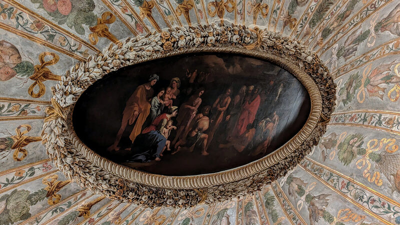 Palazzo Grimani : The Dining Room's ceiling: festoons of fowl, vegetables, and fish, intertwined with floral bands with 'Saint John baptizing the crowd' at its center