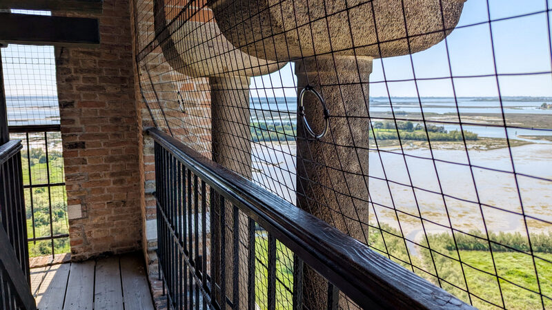 Torcello Campanile : Finally at the top, it’s reassuring to know a protective net is in place for safety, though many visitors mention it can make photographing a bit tricky