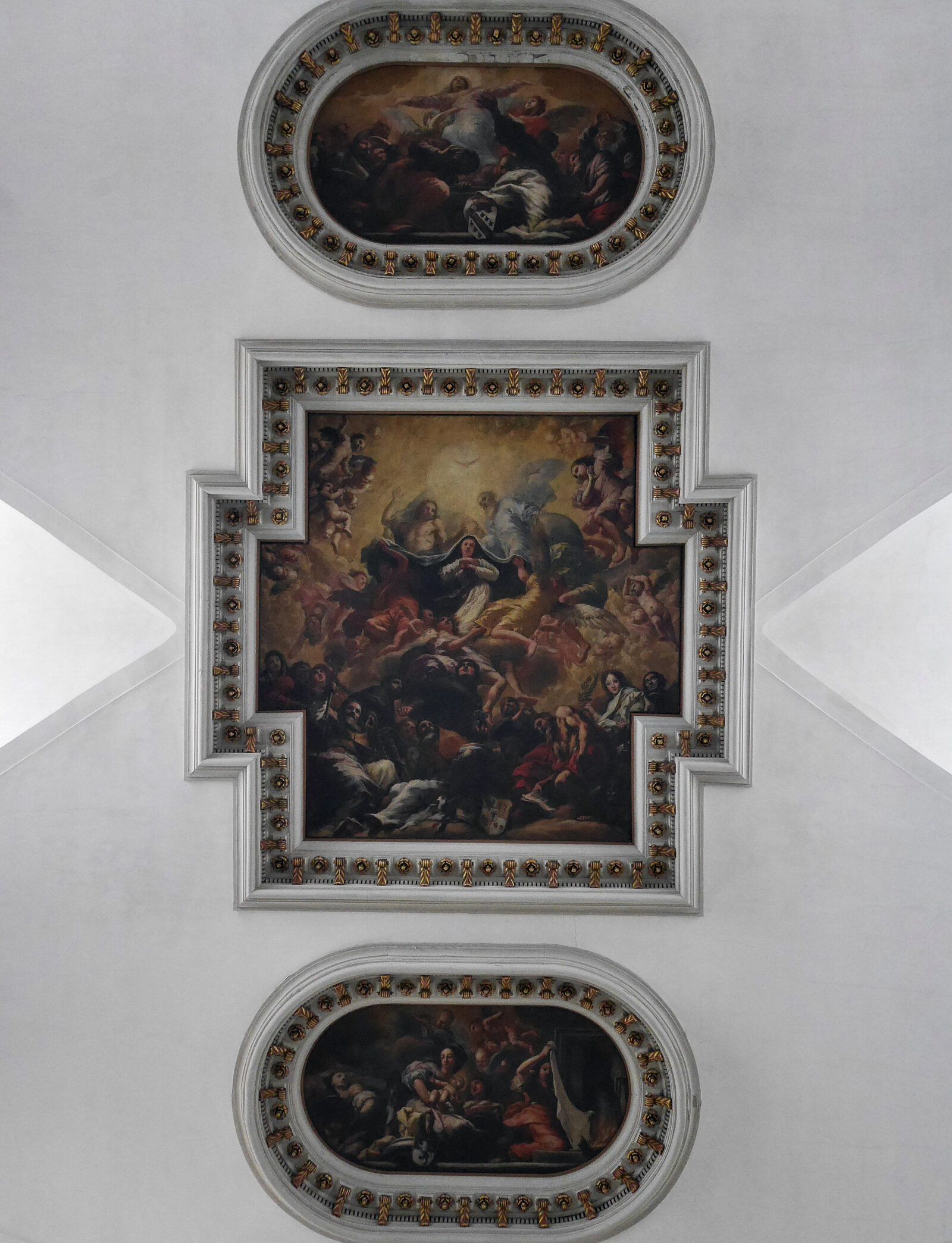 Santa Maria del Giglio : The nave ceiling features three large canvases portraying significant events in the life of the Virgin Mary: her birth, coronation, and assumption