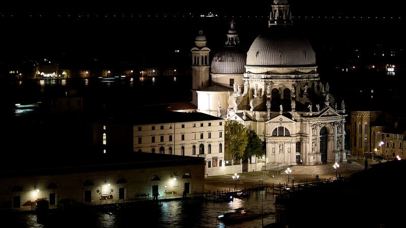 Santa Maria della Salute : Looking down from Campanile di San Marco at night, it’s as if Venice goes dark and the basilica alone remains lit