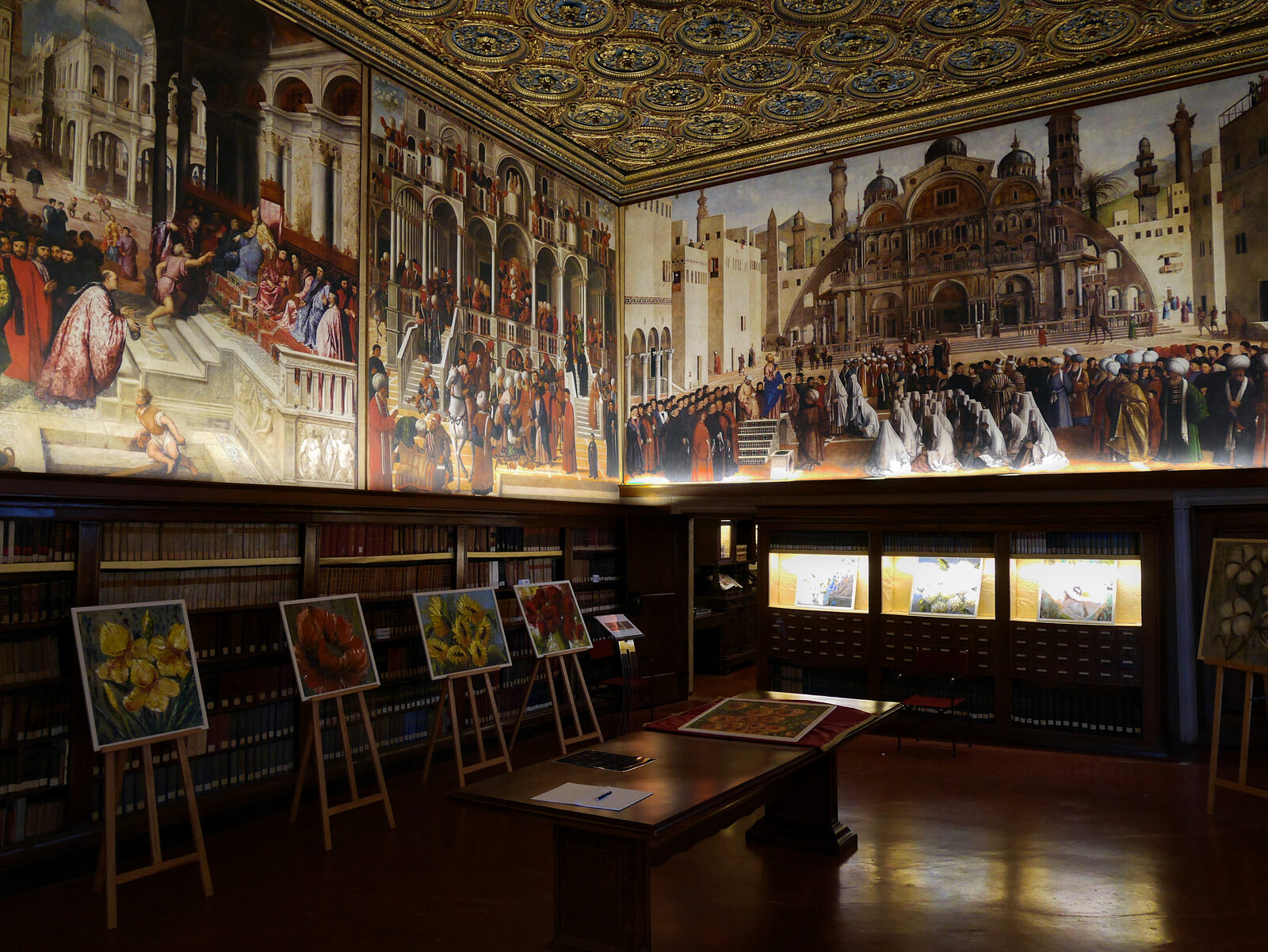 Scuola Grande di San Marco : The smaller Sala dell'Albergo (hostel room) displays digital reproductions of the paintings originally housed within, depicting episodes from the life of Saint Mark