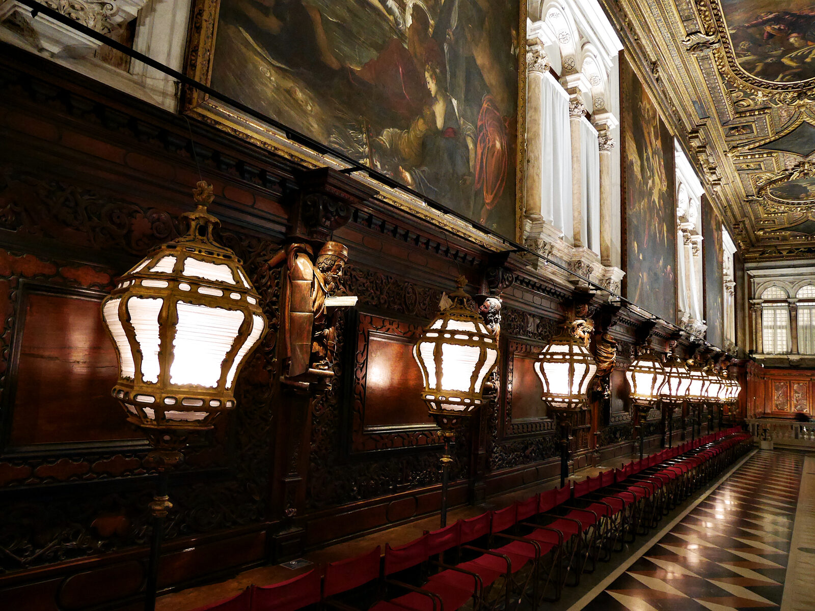Scuola Grande di San Rocco : The entire chapter hall is lined with walnut panels framed by unique allegorical sculptures crafted by Francesco Pianta