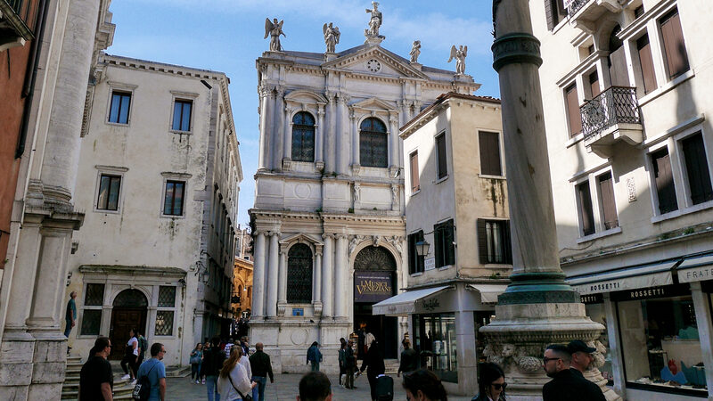 Scuola Grande di San Teodoro : Stepping back a bit in the campo and the statues atop become visible: Saint Theodore in the center and adoring angels on the sides