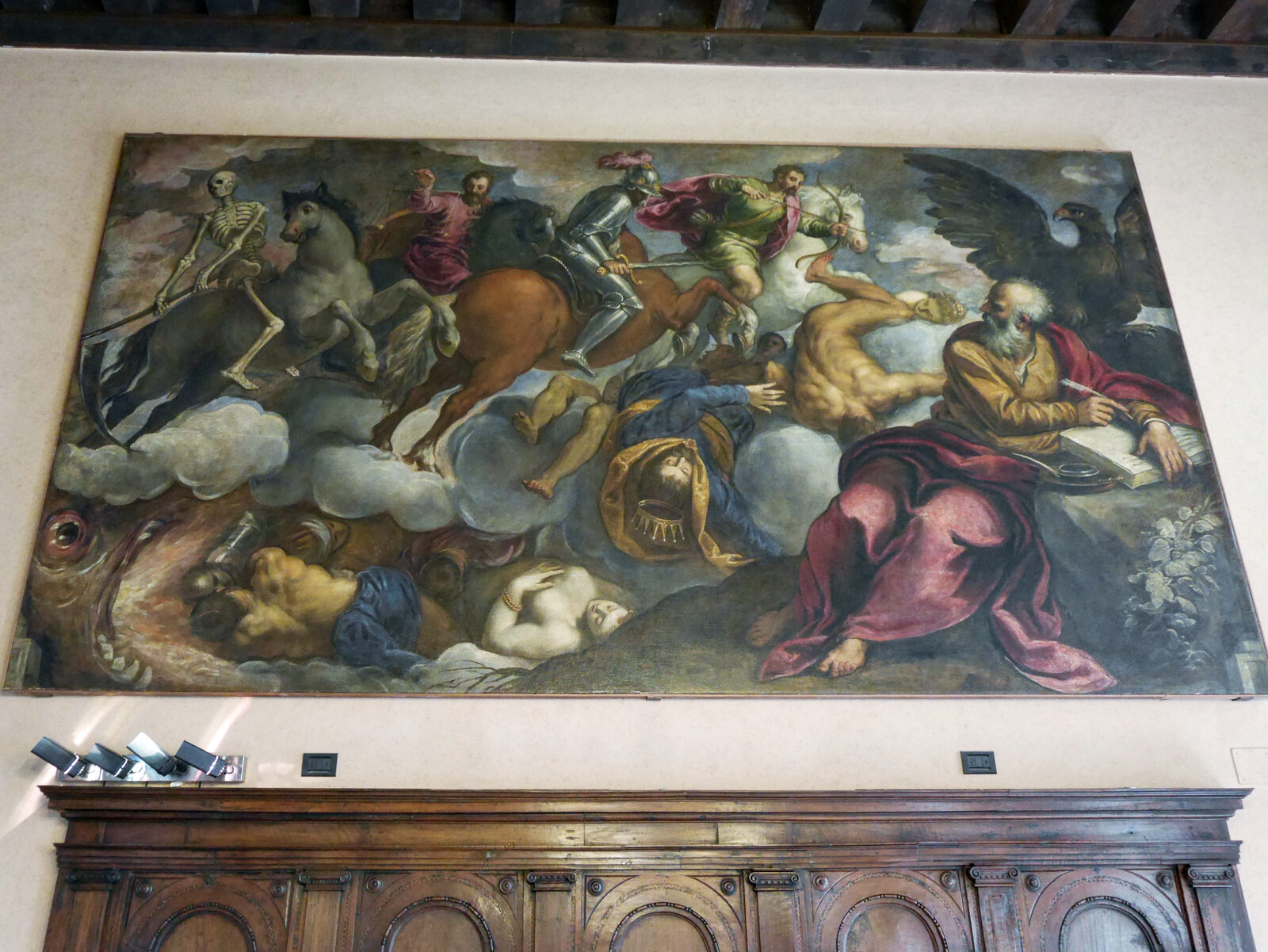 Scuola Grande San Giovanni : Perhaps the painting that immediately impresses is The Four Horsemen of the Apocalypse, with its portrayal of Hell as a terrifying, fire-breathing sea monster with gaping jaws. It depicts St. John witnessing the iconic apocalyptic figures of the four riders: Conquest, War, Famine, and Death.