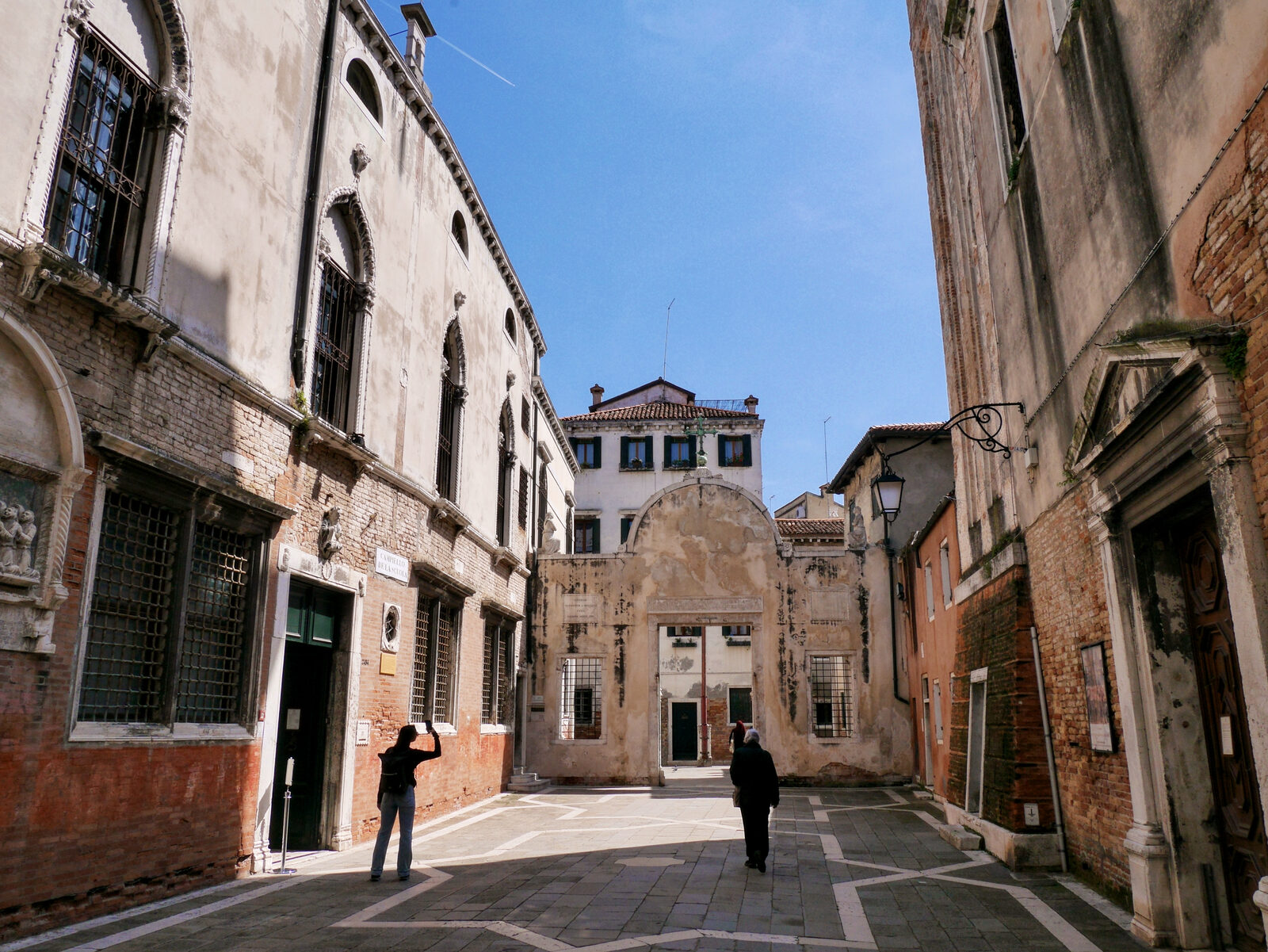 Scuola Grande San Giovanni : Looking back at the marble doorway from the small square between the Scuola on the left and the church of San Giovanni Evangelista on the right