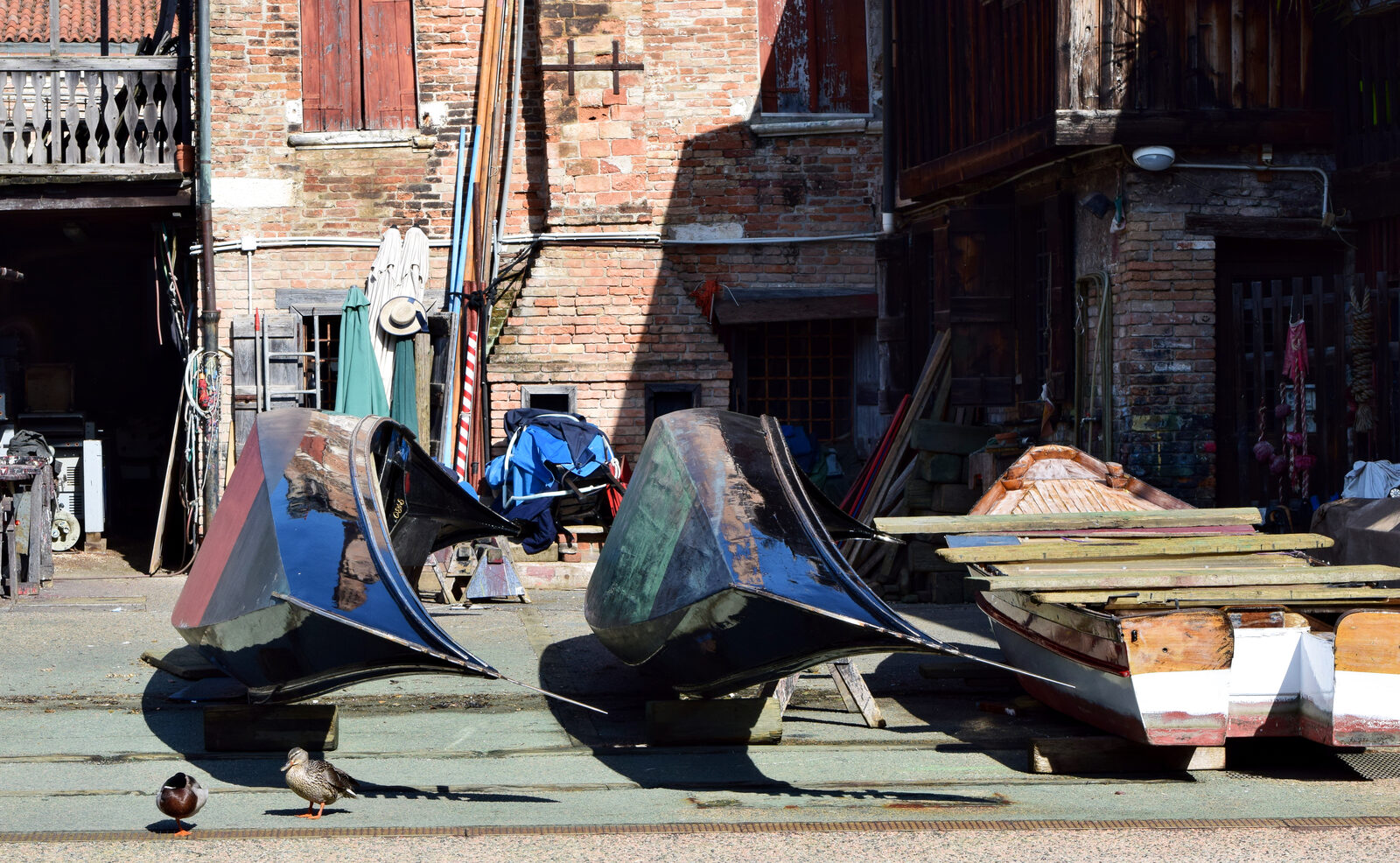 Squero di San Trovaso : Flipped over and likely due for a paint job, these gondolas expose their flat-bottomed hulls — an essential feature for navigating Venice’s shallow canals